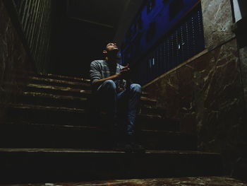 Man sitting on stairs