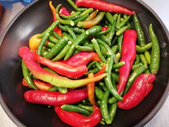 Close-up of chili peppers in container