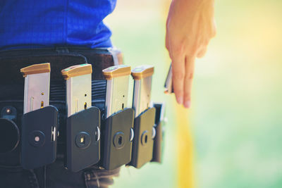 Midsection of woman removing bullet