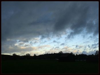 Scenic view of landscape against cloudy sky