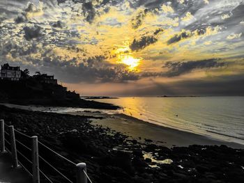 Scenic view of sea against sky at sunset