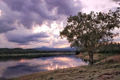 Scenic view of lake against sky during sunset