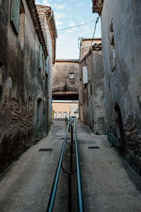 Narrow alley amidst buildings in city