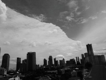 Modern buildings in city against sky