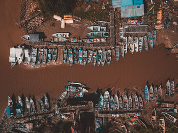 Aerial view of boats moored at lake