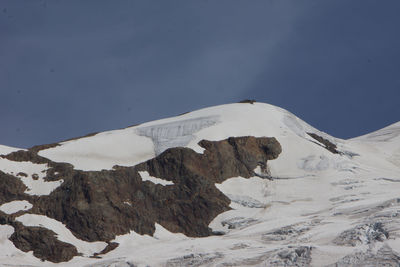 Scenic view of snowcapped mountains against clear sky