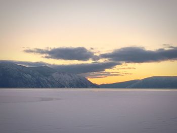 Scenic view of snow covered landscape against sky