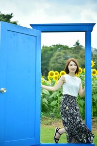 Portrait of a smiling young woman standing outdoors