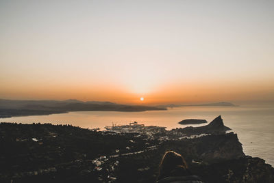 Scenic view of sea against clear sky during sunset