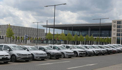 Cars on street against buildings in city