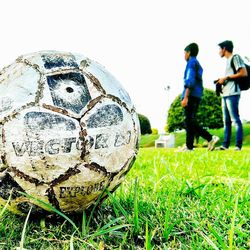 Close-up of soccer ball on field