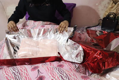 High angle view of woman sitting on table