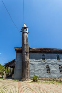 Low angle view of building against clear blue sky