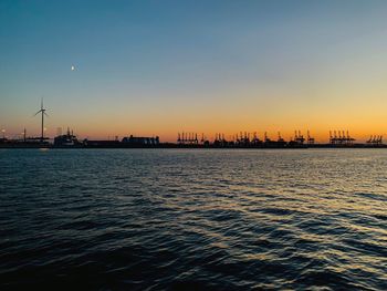 Scenic view of sea against clear sky during sunset