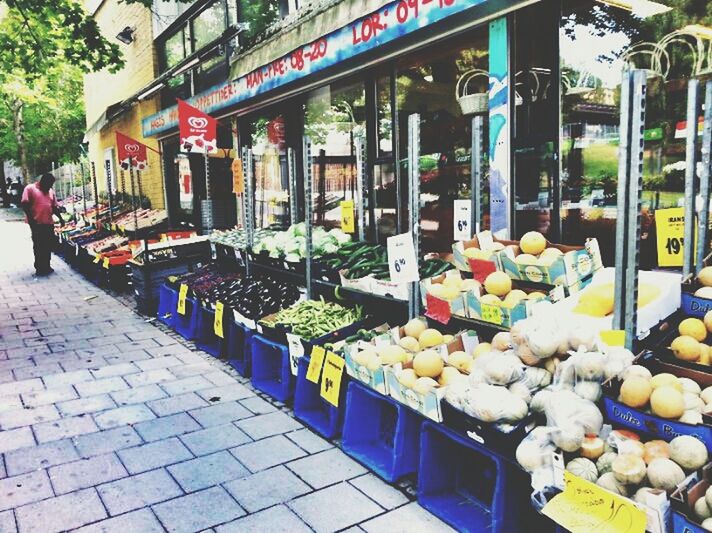 retail, food and drink, market, market stall, for sale, food, freshness, men, street, store, choice, fruit, abundance, building exterior, variation, person, city, large group of objects, incidental people