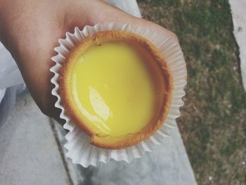 Cropped image of person holding dessert