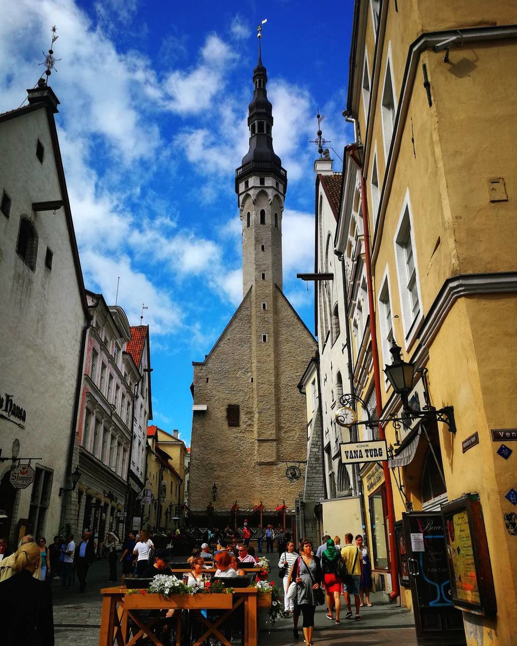 building exterior, architecture, built structure, place of worship, sky, religion, spirituality, day, cloud - sky, large group of people, outdoors, travel destinations, low angle view, real people, city, people