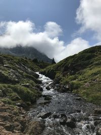 Scenic view of stream against sky