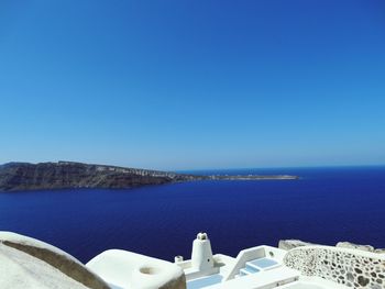 Scenic view of sea against clear blue sky