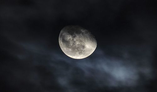 Low angle view of moon against sky at night