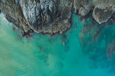 High angle view of rock formation in sea