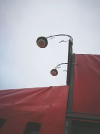 Low angle view of street light against sky