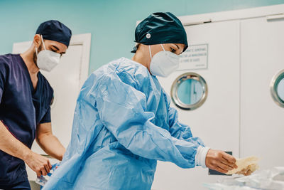 Female doctor examining patient in laboratory