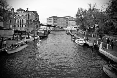 View of boats in canal along buildings