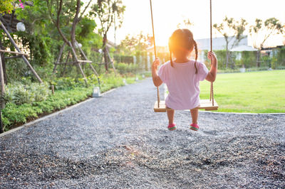 Rear view of woman in playground