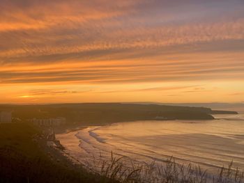 Scenic view of sea against sky during sunset