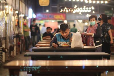 People sitting in restaurant at night