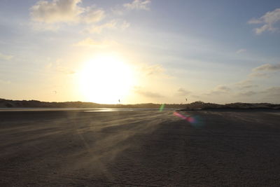 Scenic view of beach against sky during sunset