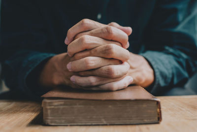 Close-up of man holding table