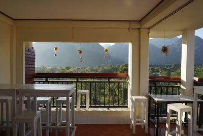 Empty chairs and tables in restaurant