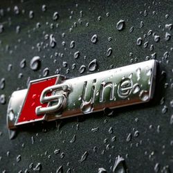 Close-up of raindrops on metal during rainy season