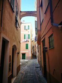 Alley amidst buildings in city