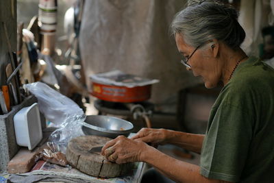 Woman working in market stall