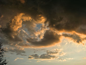 Low angle view of dramatic sky during sunset