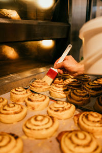 Cropped hand of person preparing food