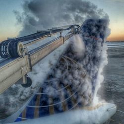 De-icing airplane at airport