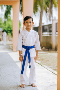 Portrait of boy standing outdoors