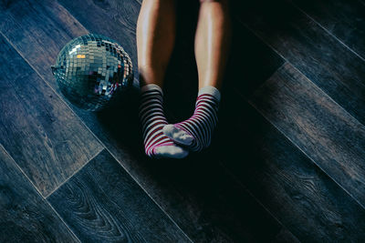 Low section of woman standing on floor