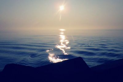 Scenic view of sea against sky at sunset