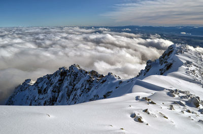 Scenic view of snowcapped mountains against sky