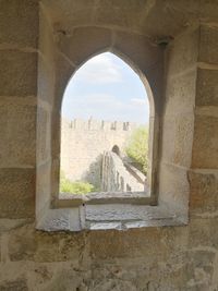 Buildings seen through arch window