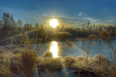 Scenic view of sunset over lake