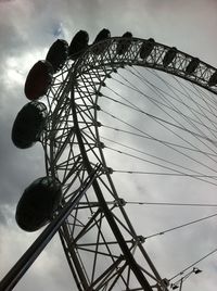 Low angle view of ferris wheel against sky