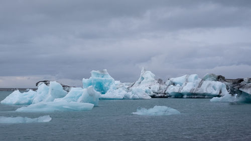 Scenic view of frozen sea against sky