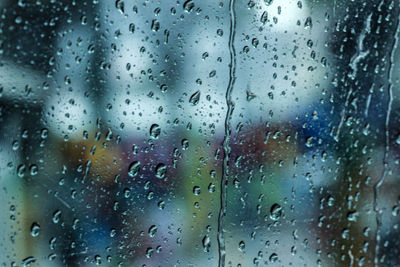 Full frame shot of wet window in rainy season