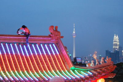 Low angle view of ferris wheel at night